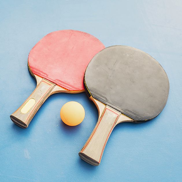 Table tennis equipment on blue table